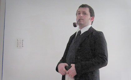 Picture of the author at his home, with his pipe.